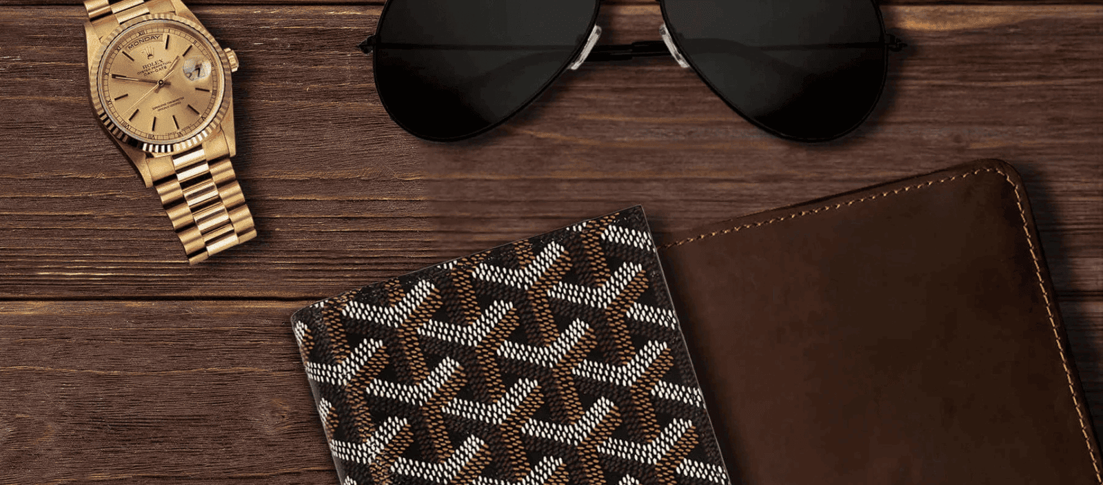 Luxury fashion accessories, stylish sunglasses, designer wallet, gold Rolex watch on wooden background.