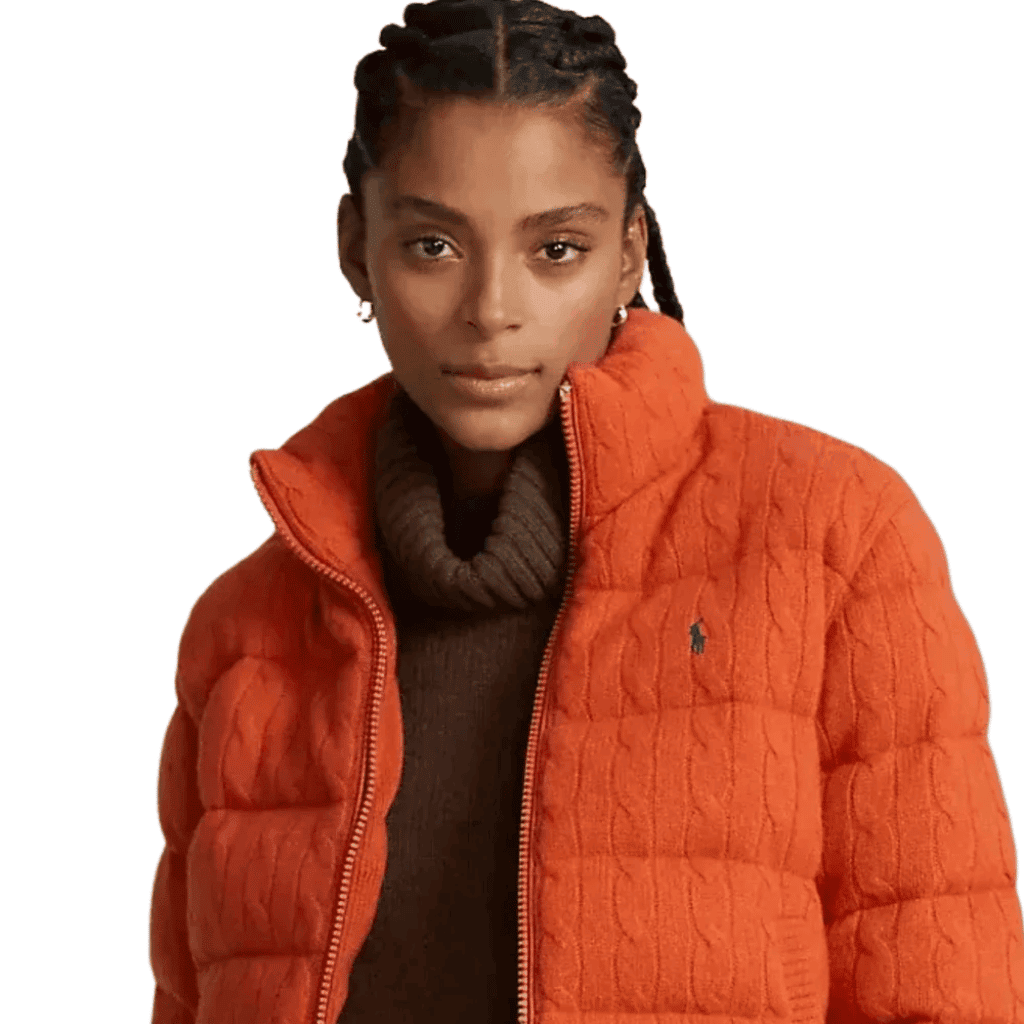 Vibrant orange puffer jacket with quilted design, perfect for stylish winter or fall outdoor wear.