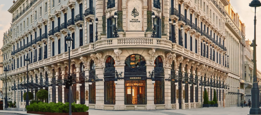 Luxury Parisian building with classic architecture and luxury boutique stores.