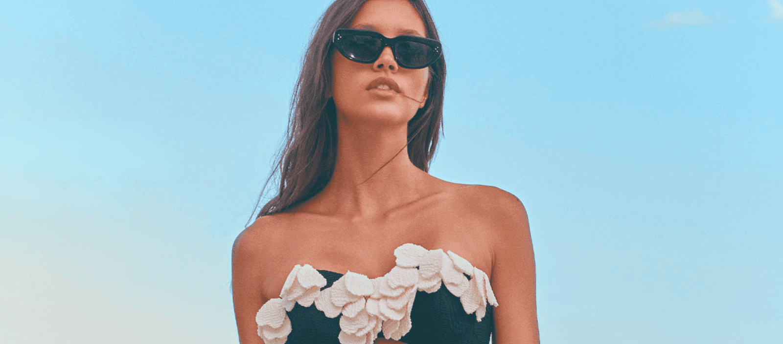Luxury women’s sunglasses and beachwear by Lush Collective for stylish summer fashion.