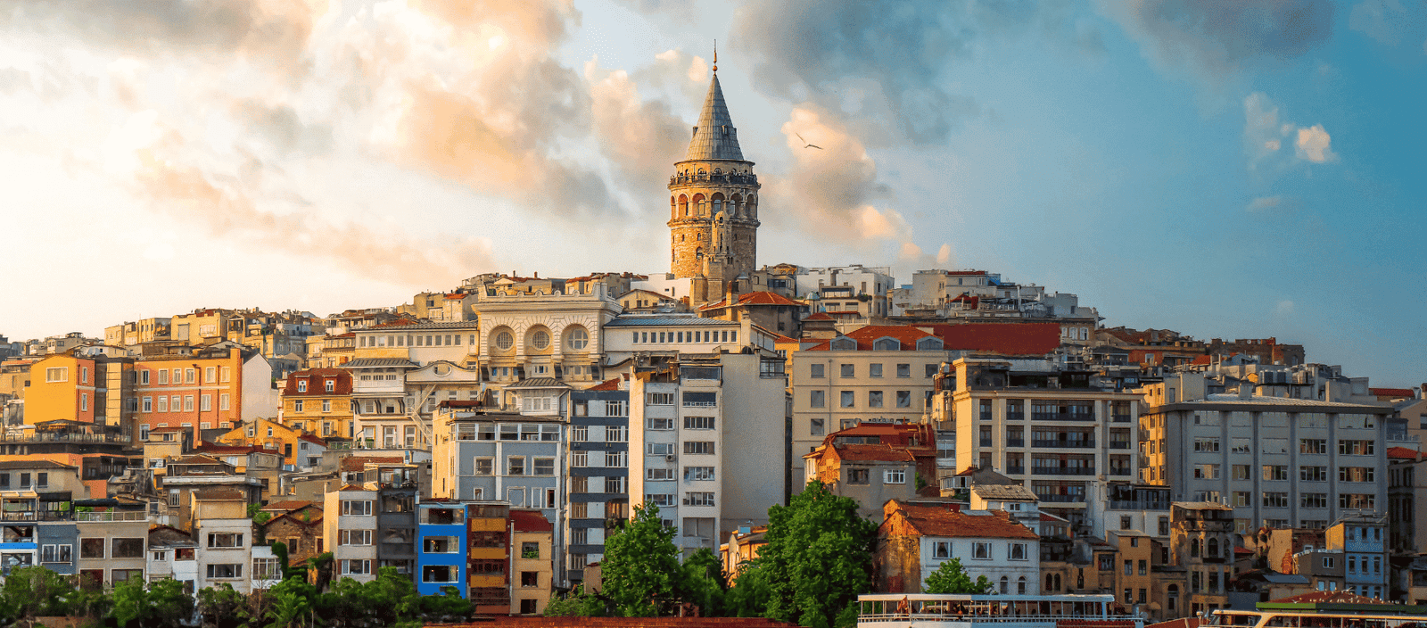 Lush Collective, vibrant cityscape with historic Galata Tower in Istanbul at sunset.