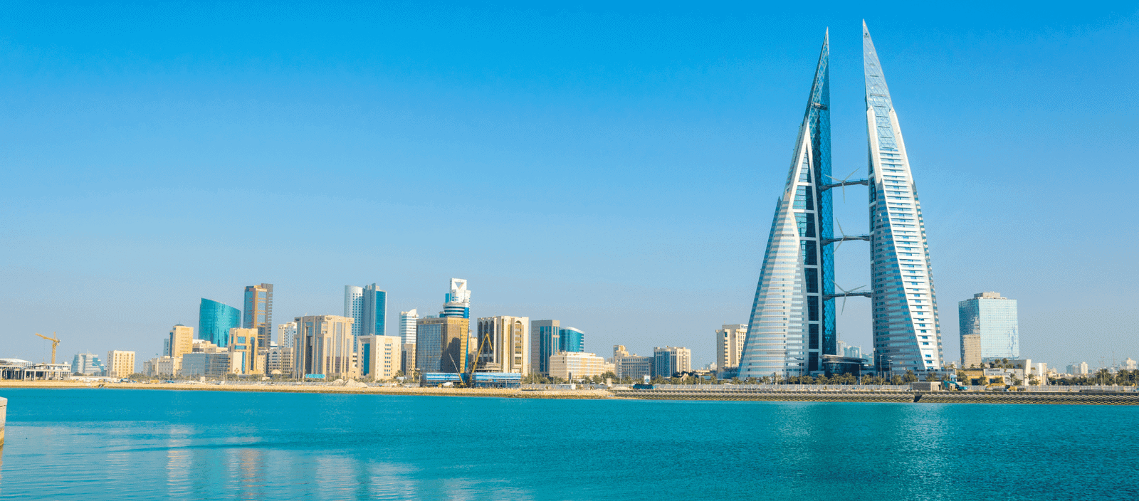 Modern Dubai city skyline with iconic Burj Al Arab hotel and waterfront views.