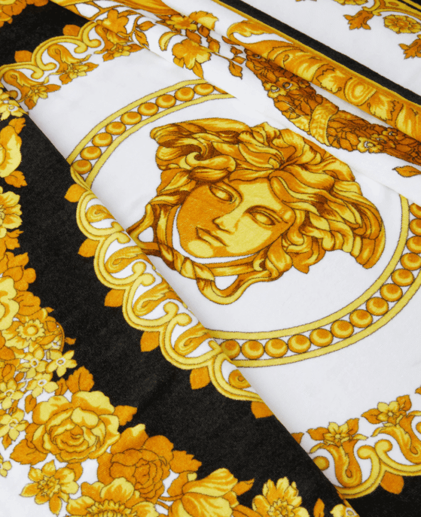 Luxurious Versace-inspired patterned fabric with gold and black accents.