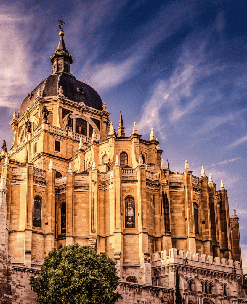 Gothic-style cathedral with ornate architecture and dramatic sky backdrop.