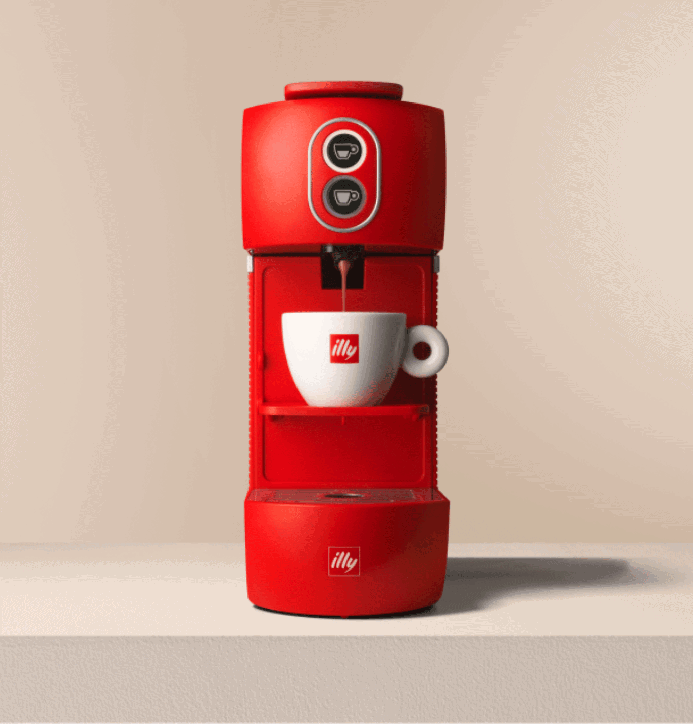 Red coffee maker with illy branded mug on beige background, modern kitchen appliance, stylish coffee brewing station.