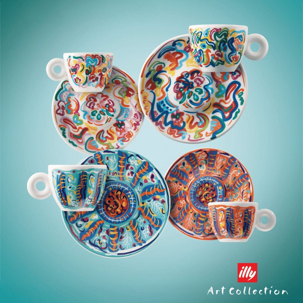 Colorful abstract artistic ceramic mug and plate set in vibrant, swirling patterns.