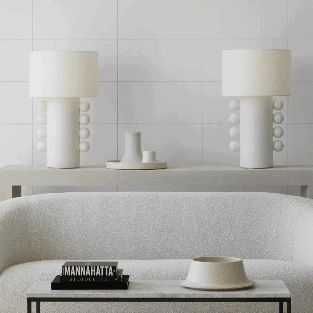 Minimalist modern decor with white table lamps and ceramic accessories for stylish interior design.