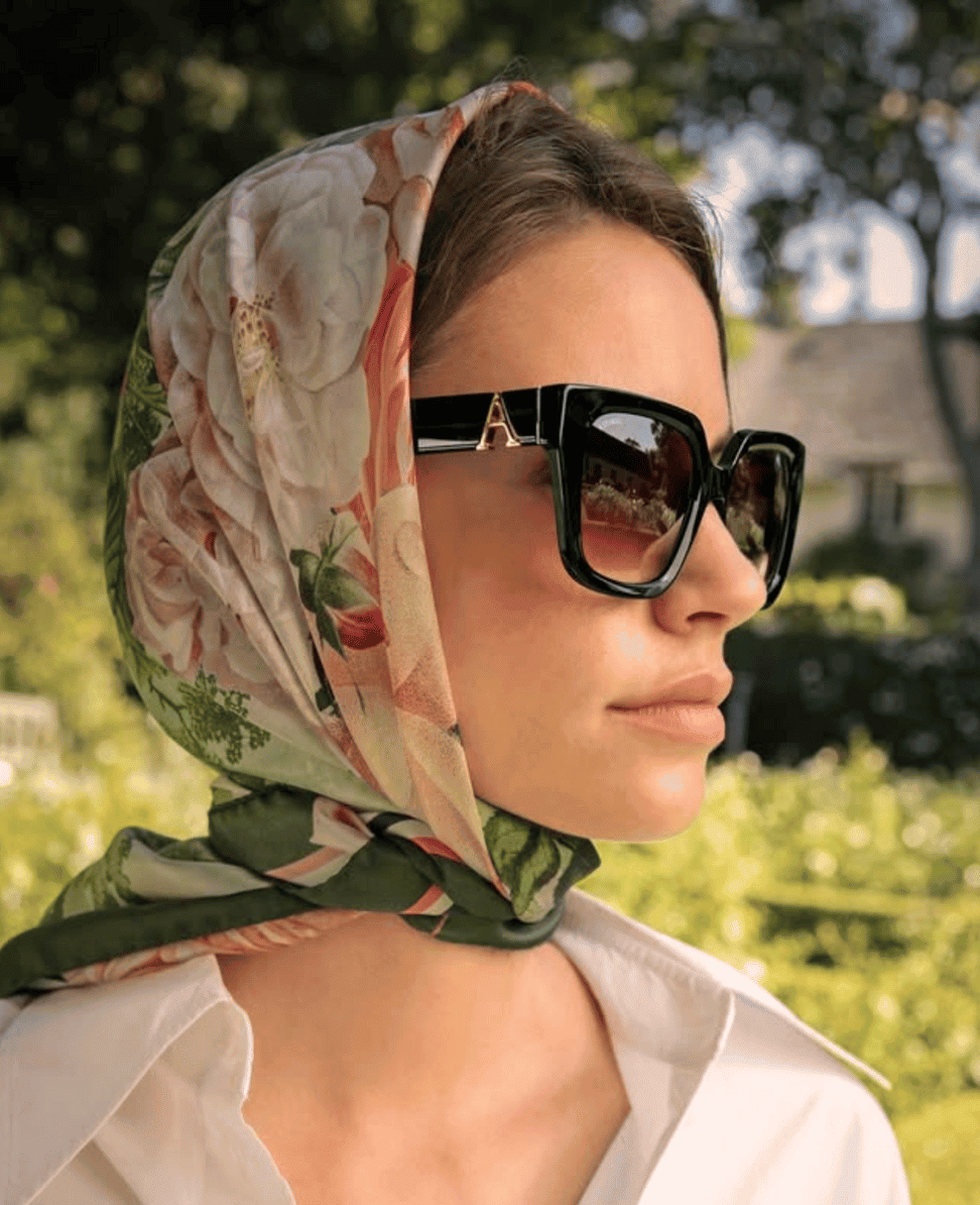 Luxury designer sunglasses with floral silk headscarf, stylish summer fashion accessory.