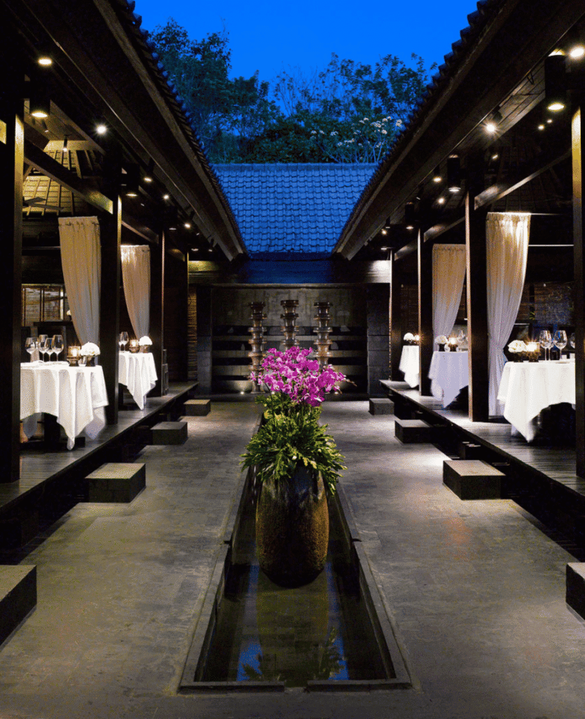 Lush Collective elegant outdoor dining area with romantic ambiance and floral decor.