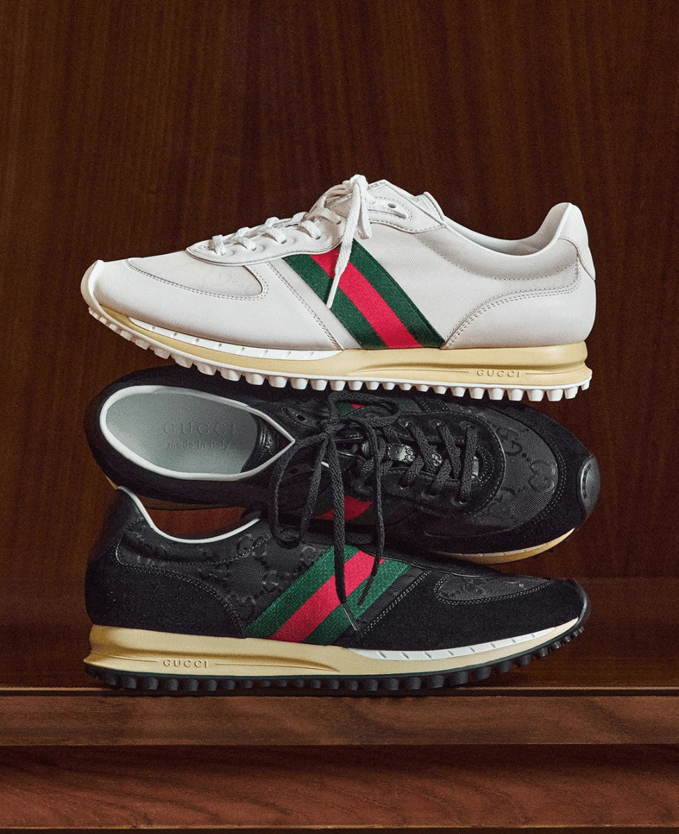 Gucci sneakers on wooden surface, stylish luxury footwear for men and women, iconic designer shoes from Lush Collective gucci sneakers, designer luxury footwear, stylish athletic shoes, Lush Collective.