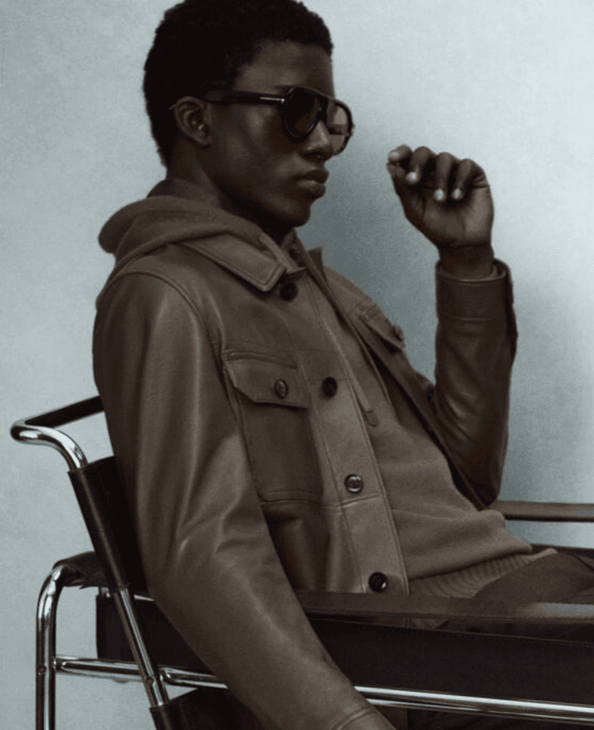 Leather jacket, stylish woman, sunglasses, fashion statement, modern accessories.