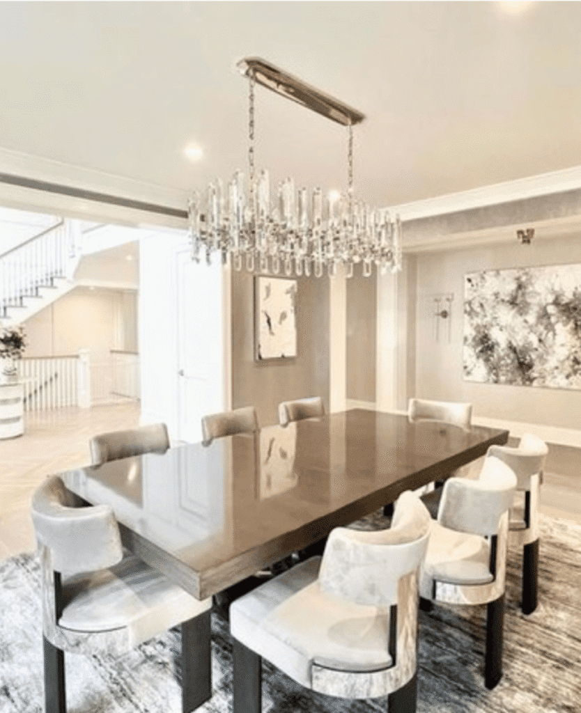 Luxury dining room with chandelier and modern decor, elegant interior design, high-end furniture and artwork, sophisticated home ambiance, Lush Collective style.