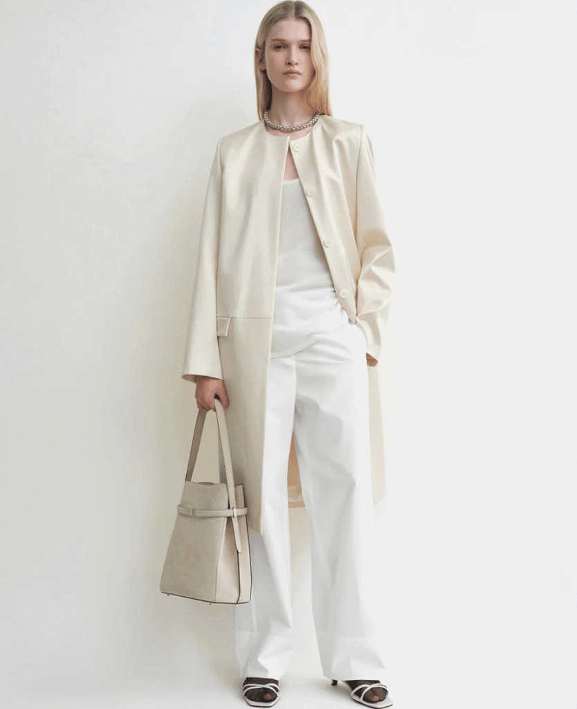 Luxurious beige long coat with tailored design, perfect for elegant winter fashion.