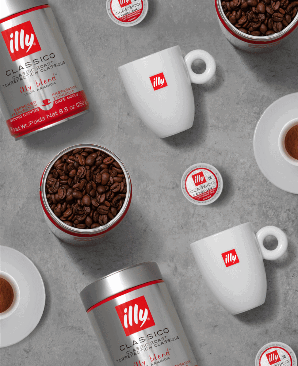 Rich coffee beans and mugs with Illy coffee products, perfect for a cozy morning routine.