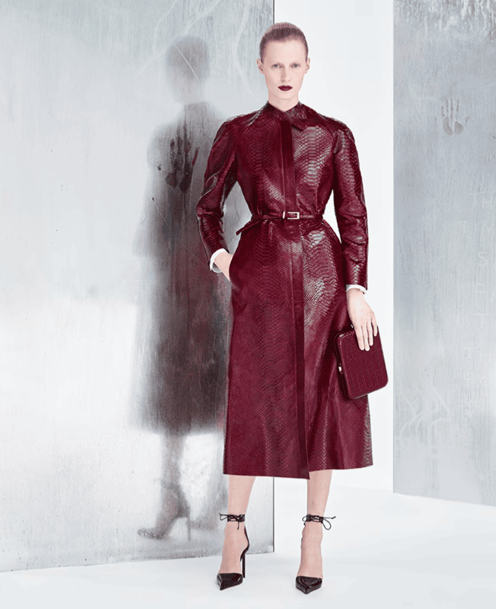 Sleek burgundy leather trench coat fashionable women stylish outerwear.